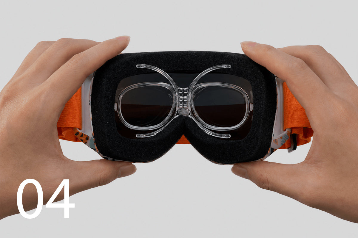 Prescription goggle insert fully installed and centered inside the sports goggles.